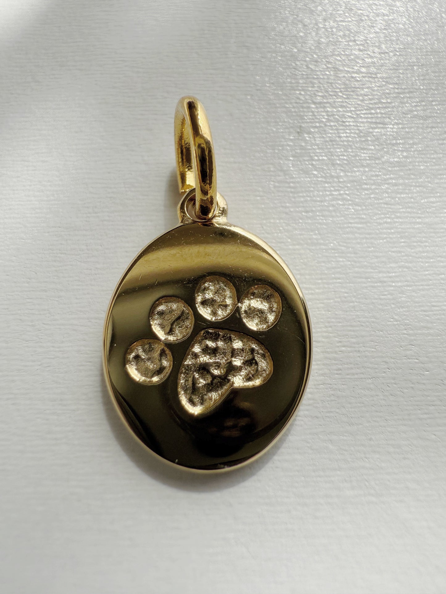 Huellita dorada Charm